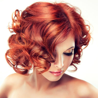 coloration-red with curly hair